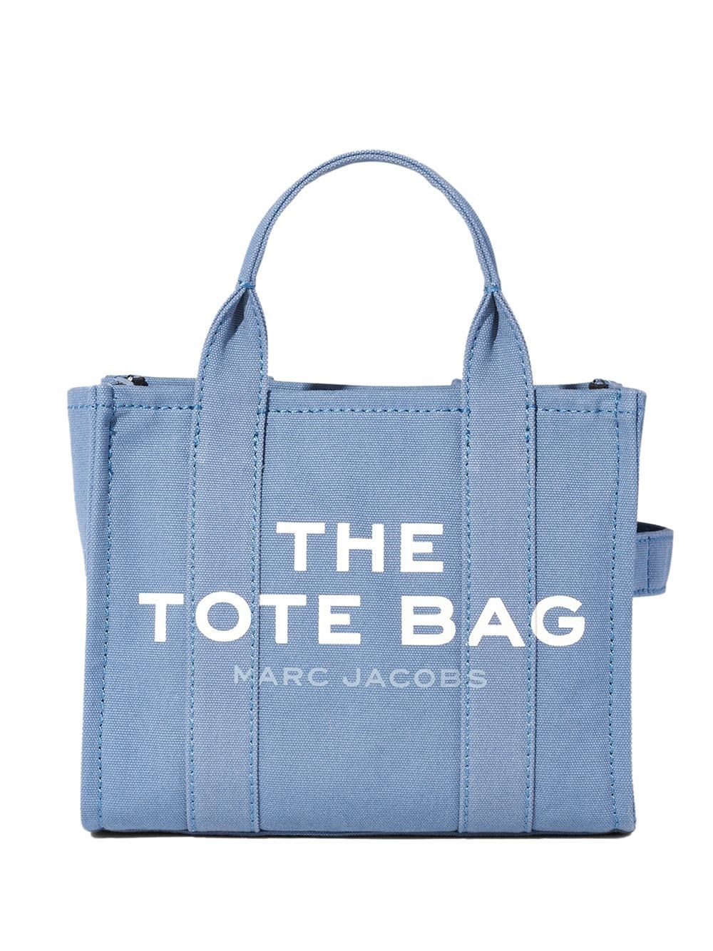 Wound up getting one of the Marc Jacobs totes, mini size in denim because I  got it for a really good price. At first it bothered me that it says “The  Tote